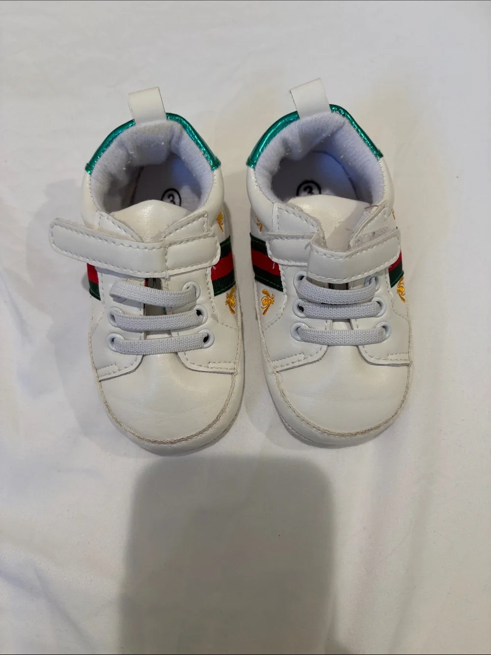 White Kids Sneakers with Green & Red Accent. Baby shoes